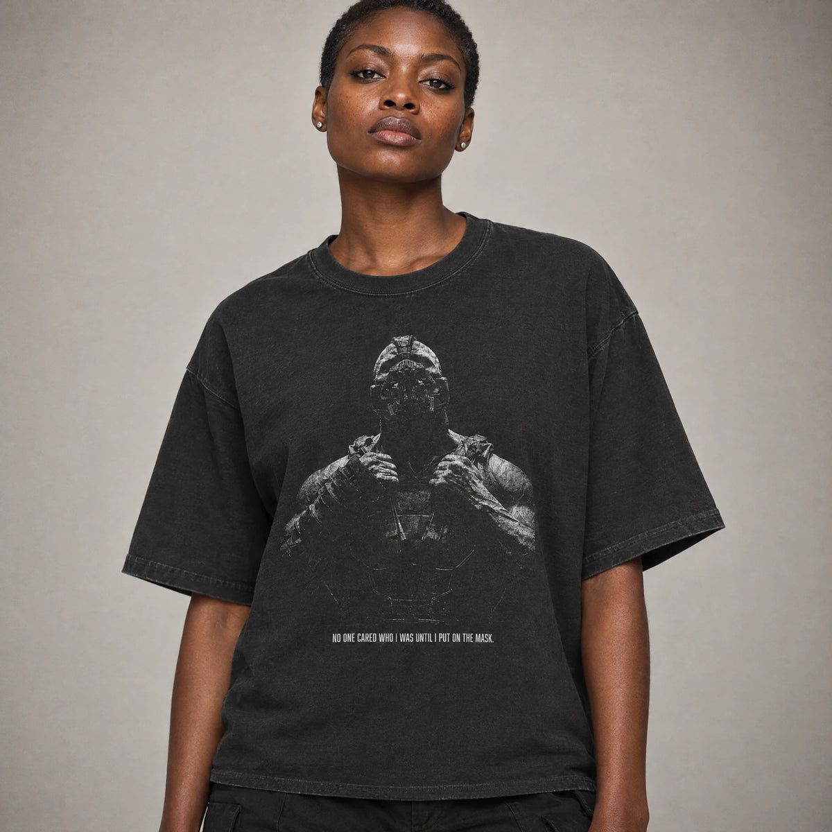 Behind the mask masked villain quote tee on a model, black