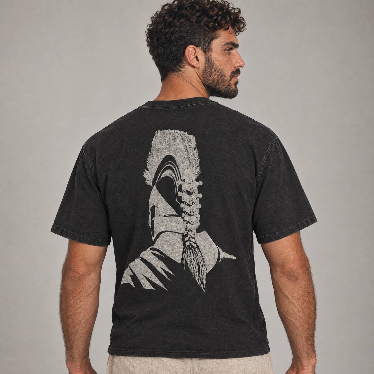 Odyssey Greek warrior helmet tee back print on a model, black